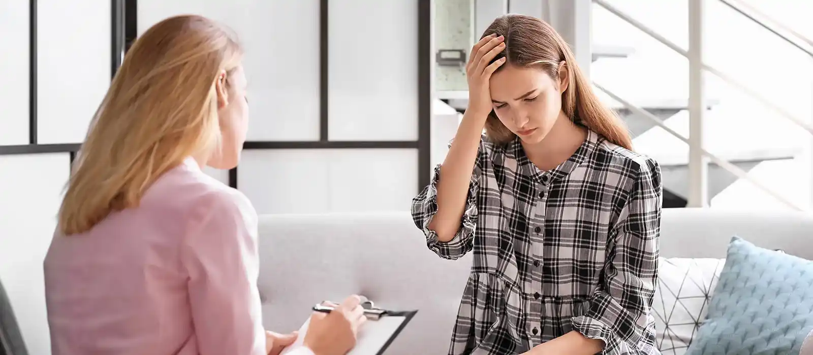 A girl having CBT session with an expert therapist