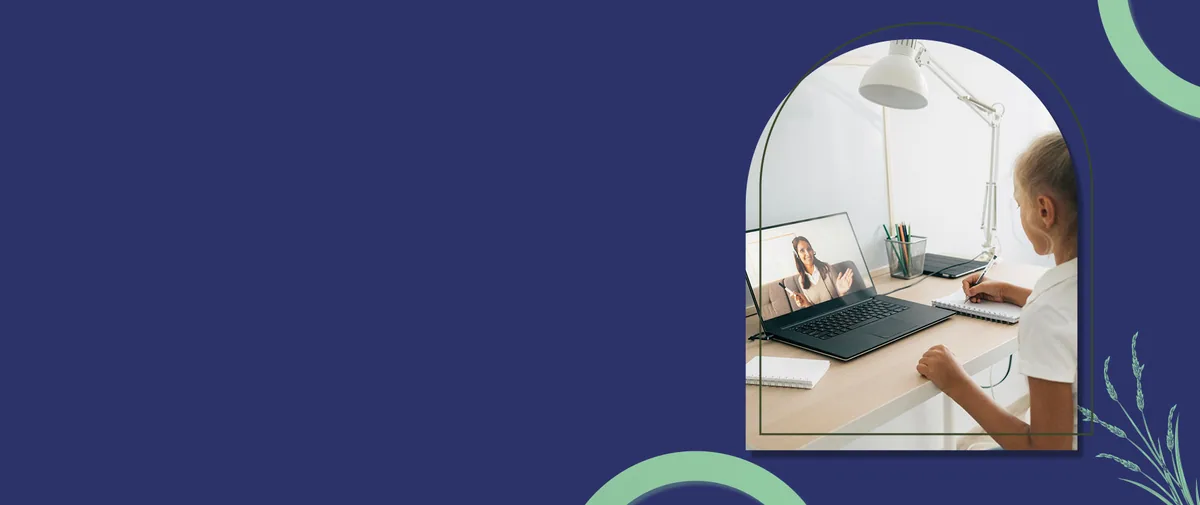A teenager sits calmly at a desk during an online therapy session on a laptop
