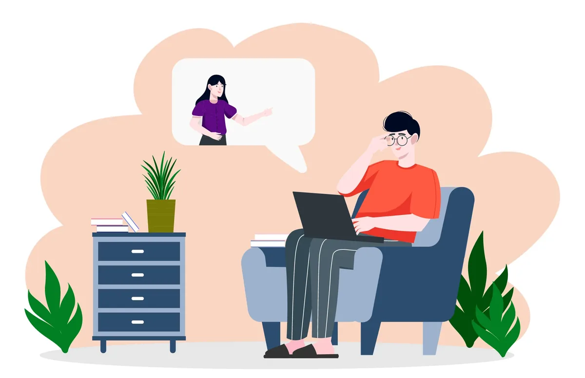 Person relaxing in an armchair during an online talk-therapy session at home